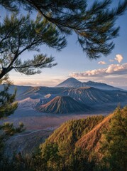 Dramatic mountain landscape with peaks under a clear blue sky and scattered clouds