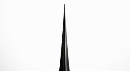 Sleek black obelisk against white background