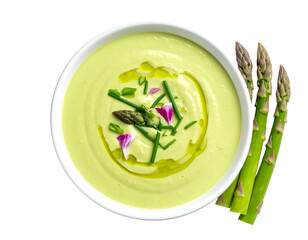Creamy green soup with asparagus spears, herbs, and oil