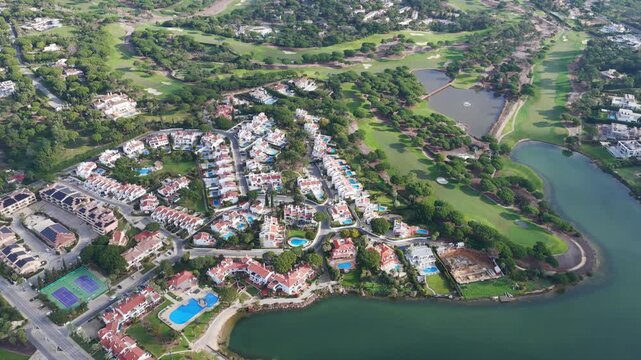 Exclusive Luxury Real Estate at San Lorenzo Golf Course: 4K Aerial View of Palatial Mansions, Private Infinity Pools, and Championship Fairways in Quinta do Lago, Algarve, Portugal