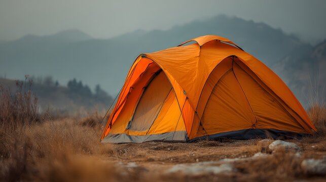 Vibrant Orange Tent Set Up in a Serene Mountain Landscape at Dawn. - Powered by Adobe