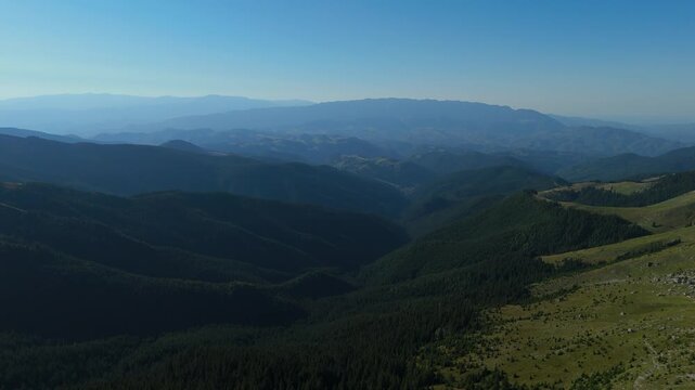 Wide Aerial Panorama over Moieciu de Sus and Rucar Bran Corridor Revealing Piatra Craiului Ridge and Distant Fagaras Silhouettes