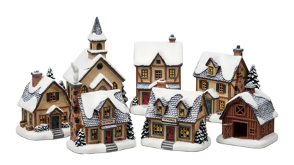 Charming snow-covered miniature Christmas village display featuring quaint houses, a church, and a barn, perfect for festive holiday decor