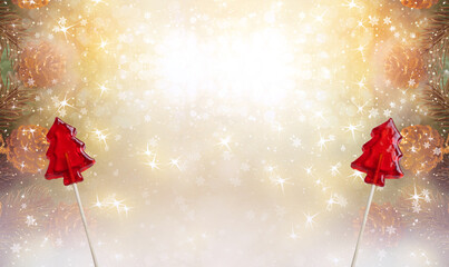 Christmas background with candy sweet lollipop in fir tree shape and cones for decoraton. New Year winter holidays fantasy concept with decorations and copy space, snowy shiny wide banner.