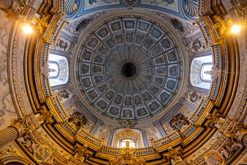 Intricate dome ceiling with frescoes and ornate details © Joseph Creamer