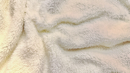 soft creamy white fluffy fleece texture undulates gently in macro closeup evoking cozy winter warmth ideal for serene wallpaper or minimalist banner background © Arthur