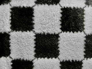 fluffy black white checkerboard shag rug closeup texture radiating cozy geometric harmony perfect for abstract wallpaper or modern graphic background