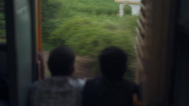 Men Sitting in a Moving Train