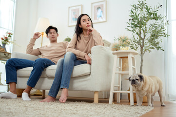 Quarrel Between Asian Couple Revealing Issues of Infidelity and Emotional Distance in a Cozy Setting
