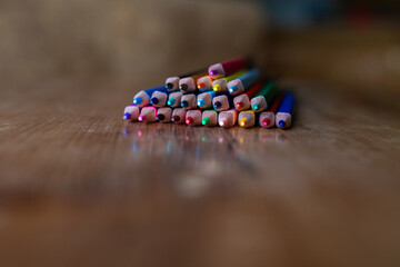 Macro closeup of colorful pencil tips with shallow depth of field.