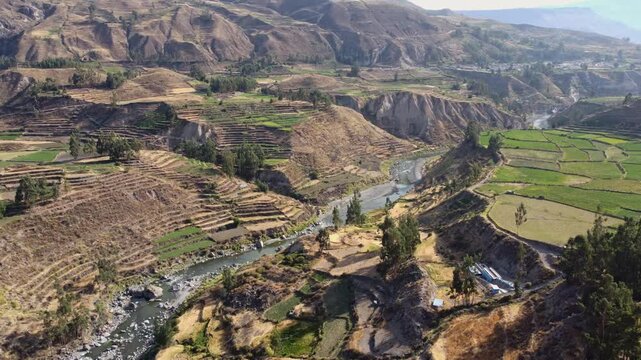 Aerial drone flying forward over Colca Valley and Colca River, Peru