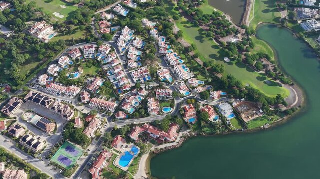 Exclusive Luxury Real Estate at San Lorenzo Golf Course: 4K Aerial View of Palatial Mansions, Private Infinity Pools, and Championship Fairways in Quinta do Lago, Algarve, Portugal