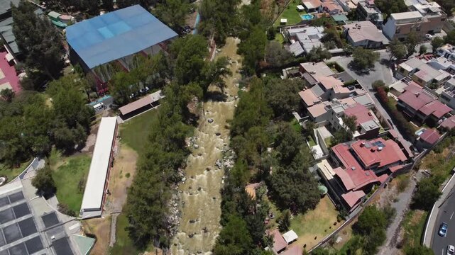 Aerial drone shot rising from Chili River to Misti Volcano in Arequipa, Peru