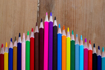 Color pencil pyramid graph representing growth and achievement.