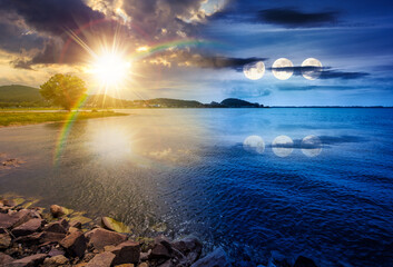 tree on the shore of lake in summer. time change concept. beautiful scenery with large body of water, sun and moon. distant mountain range. uncertainty, trust issues, and difficult relationship