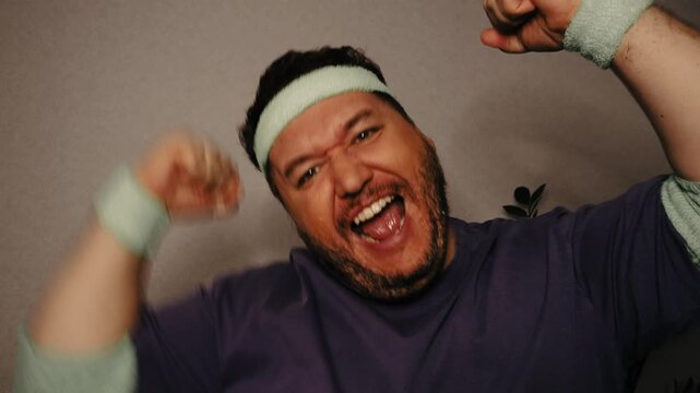 Funny fat man doing fitness.