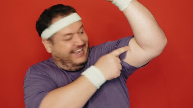 Funny fat man doing fitness.