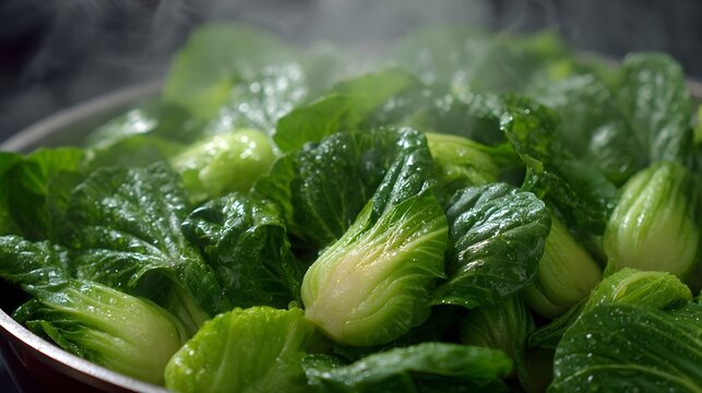Steaming fresh bok choy with visible moisture and steam highlighting its vibrant green leaves in a close up culinary shot