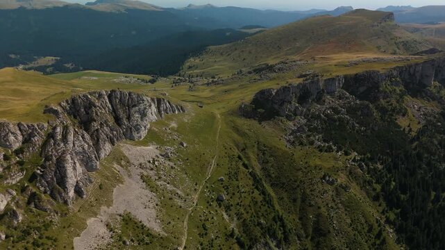 High Altitude Aerial Fly Over Saua Strunga Pass and Strungile Peaks with Tataru Summit and Ialomita Valley Background