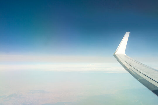 Jet Engine and Wing of an Aircraft in Flight