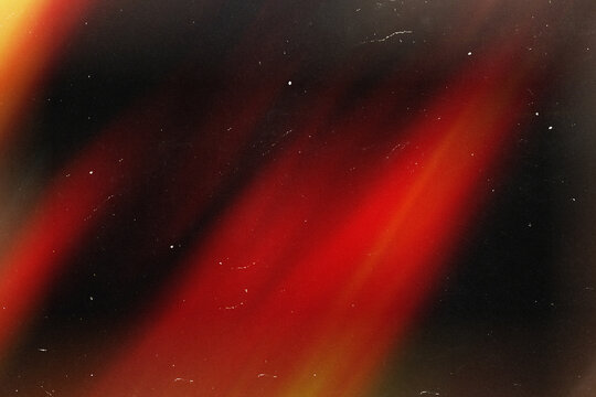 Retro film overlay effect with scratch dust and light leaks, retro grain noisy film distressed texture light leak flare on black background. Grunge design. Wallpaper. Yellow red warm gradient