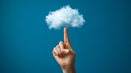 This image features a human hand reaching out and touching a white cloud against a blue sky background. The action suggests innovation or connection with technology or virtual services.