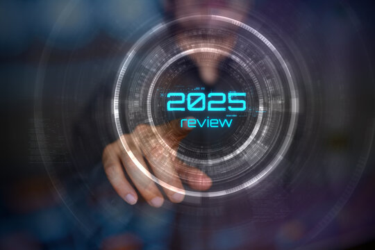 Man presses holographic 2025 year review button. Concept of new year, annual plan, growth strategy, business planning, recap, investment trends and strategy road map.