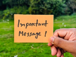 Important announcement sign holding, Important notification icon postcard, Important notice hand note image with green backdrop