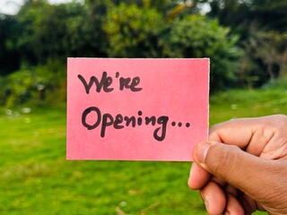 We are Open sign sticky note holding, Open now handnote sign icon