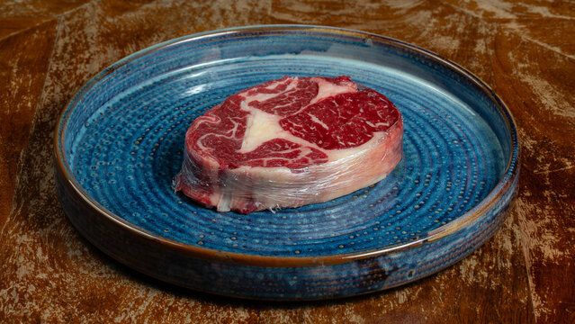Raw beef meat for steak on plate plate