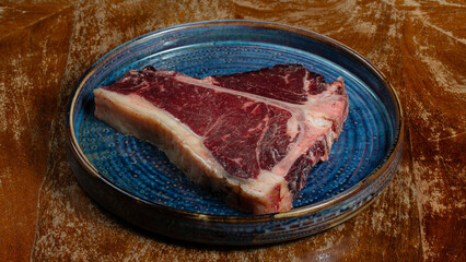 Raw beef meat for steak on plate plate