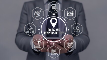 Business professional displaying 'Roles and Responsibilities' concept on tablet