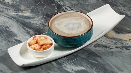 Bowl of mushrooms soup isolated