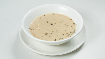 Bowl of mushrooms soup isolated