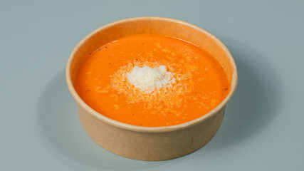 Bowl of pumpkin soup isolated