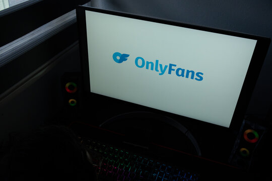 Punta Arenas, Chile &ndash; December 22, 2025: The OnlyFans corporate logo and icon are displayed on a computer monitor in a dark home office setting