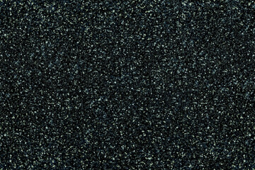 Deep teal glitter overlay background with dense shimmering aqua and silver particles on dark surface, luxurious cool sparkling texture perfect for winter celebrations, elegant cards and modern designs