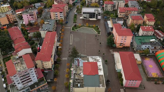 Aerial video of Rr&euml;shen with Abat Do&ccedil;i Square, colourful buildings and autumn hills stretching across the Mirdit&euml; region of Northern Albania. 
