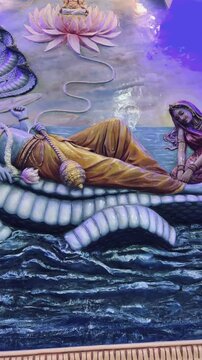 Lord Vishnu reclining on the cosmic serpent Sheshnag, symbolizing creation, cosmic rest, eternity, and universal balance.