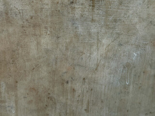 Weathered beige wall showing scratches and grunge texture © Enigma