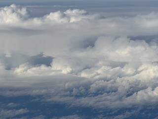 Fototapeta premium Aerial view of cumulus clouds creating a natural cloudscape atmosphere