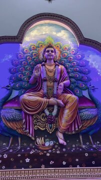 Lord Kartikeya seated on a peacock, symbolizing wisdom, youth, victory, and spiritual discipline, surrounded by radiant colors and sacred aura.