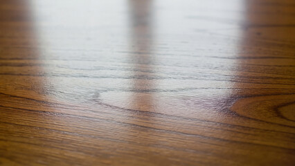 Smooth timber grain showing horizontal fiber pattern in soft diffused light with selective focus for warm organic backdrop