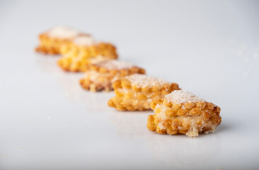 Cottage cheese cookies with sugar on a white background, space for text. selective focus