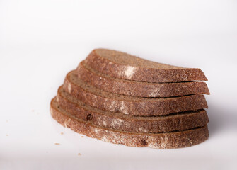 A stack of rye bread on a white background, space for text