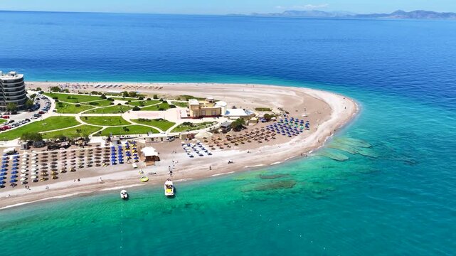 Aerial drone cinematic video of Rodos  or Rhodes island town Elli beach and peninsula a popular summer tourist destination, Dodecanese, Aegean, Greece
