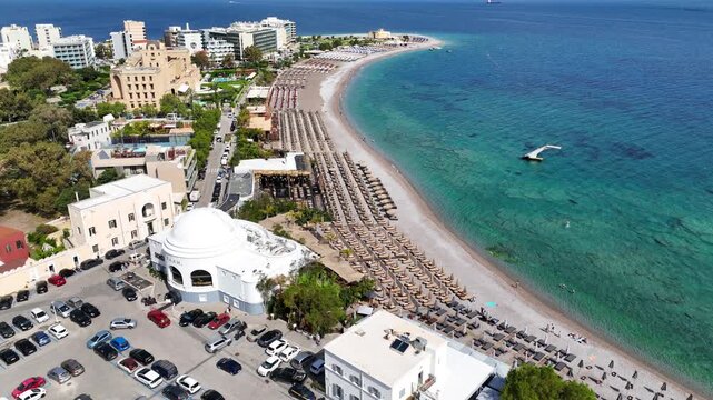 Aerial drone cinematic video of Rodos  or Rhodes island town Elli beach and peninsula a popular summer tourist destination, Dodecanese, Aegean, Greece
