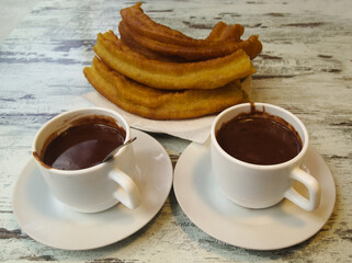 Dark thick hot chocolate drink in a white cup