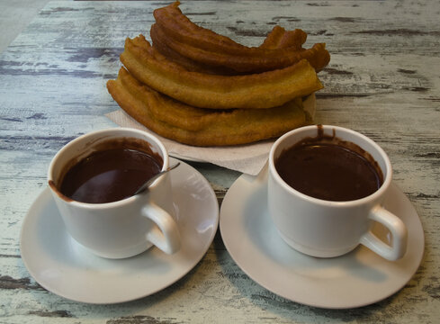 Dark thick hot chocolate drink in a white cup
