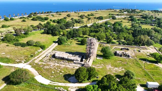 Aerial drone cinematic video of archaeological site of Acropolis, Odeon and Ancient stadium of Rhodes in area of Monte Smith, Rhodes island, Dodecanese, Greece